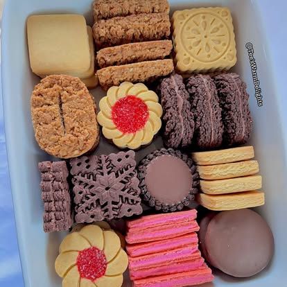 An assorted biscuit platter on a blue-rimmed plate.