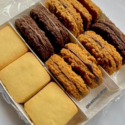 A tray of assorted biscuits laid out in neat rows.