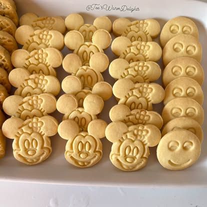 Trays of shaped and stamped tea biscuits.