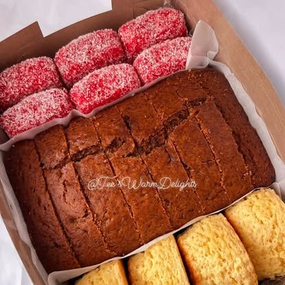Strawberry whirls beside a sliced chocolate loaf.
